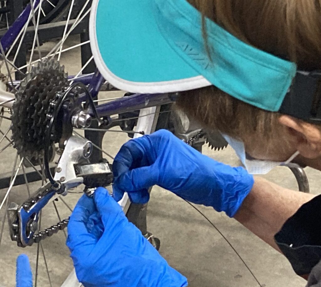 hands working on gears